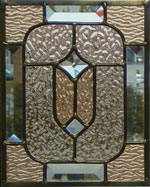 Decorative panel with champaign colored glass with textured glass and bevels, lead chanel method